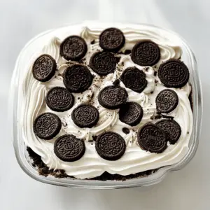 This Heavenly Oreo Dessert is sure to be a hit at any gathering! With layers of creamy goodness and crunchy Oreo cookie crumbles, it’s a chocolate lover’s dream. Perfect for potlucks, parties, or a sweet treat at home. Save this recipe now for an easy and delicious dessert that everyone will rave about!