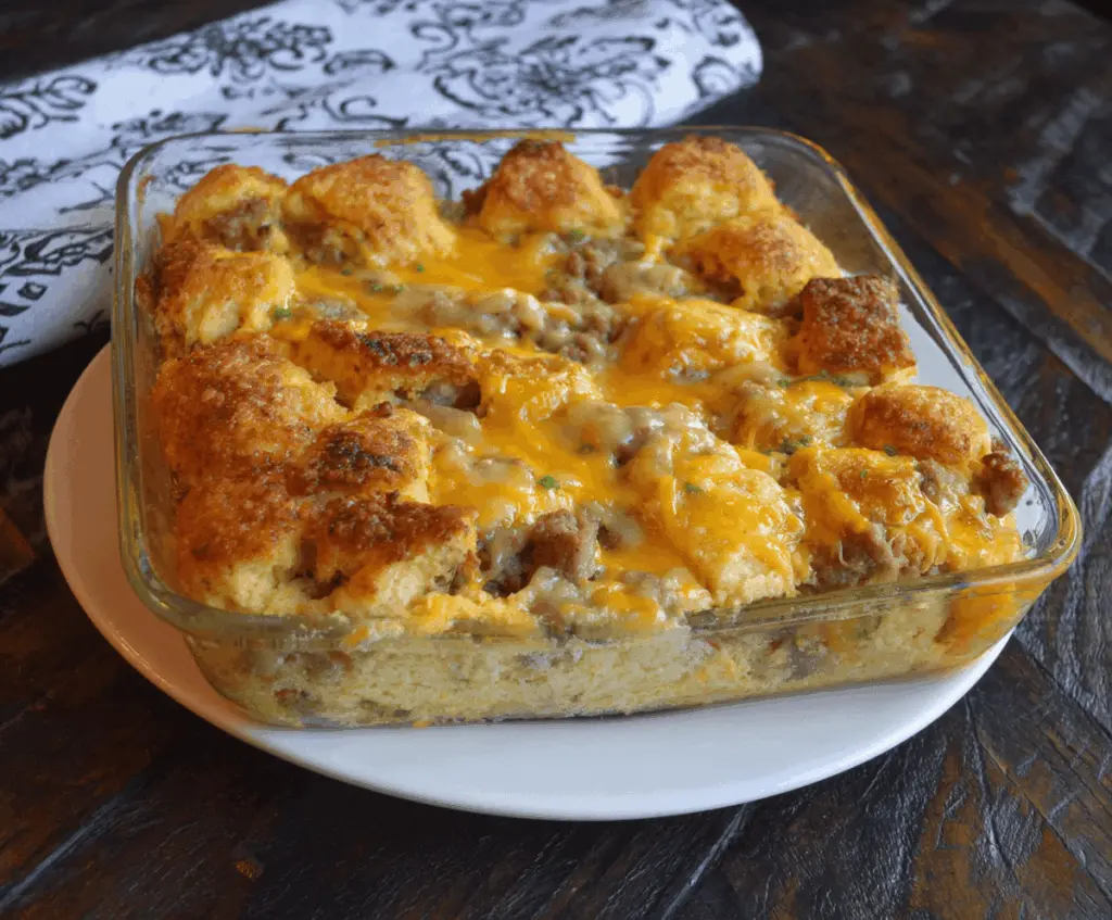 Delicious Biscuits and Gravy Breakfast Casserole with golden biscuits topped with creamy gravy and cheese.