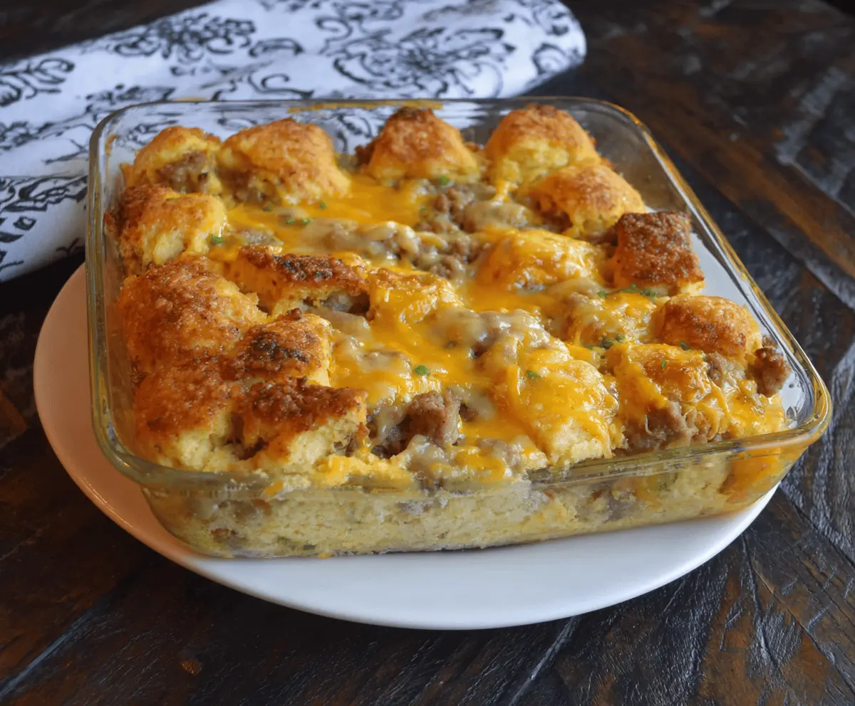 Delicious Biscuits and Gravy Breakfast Casserole with golden biscuits topped with creamy gravy and cheese.