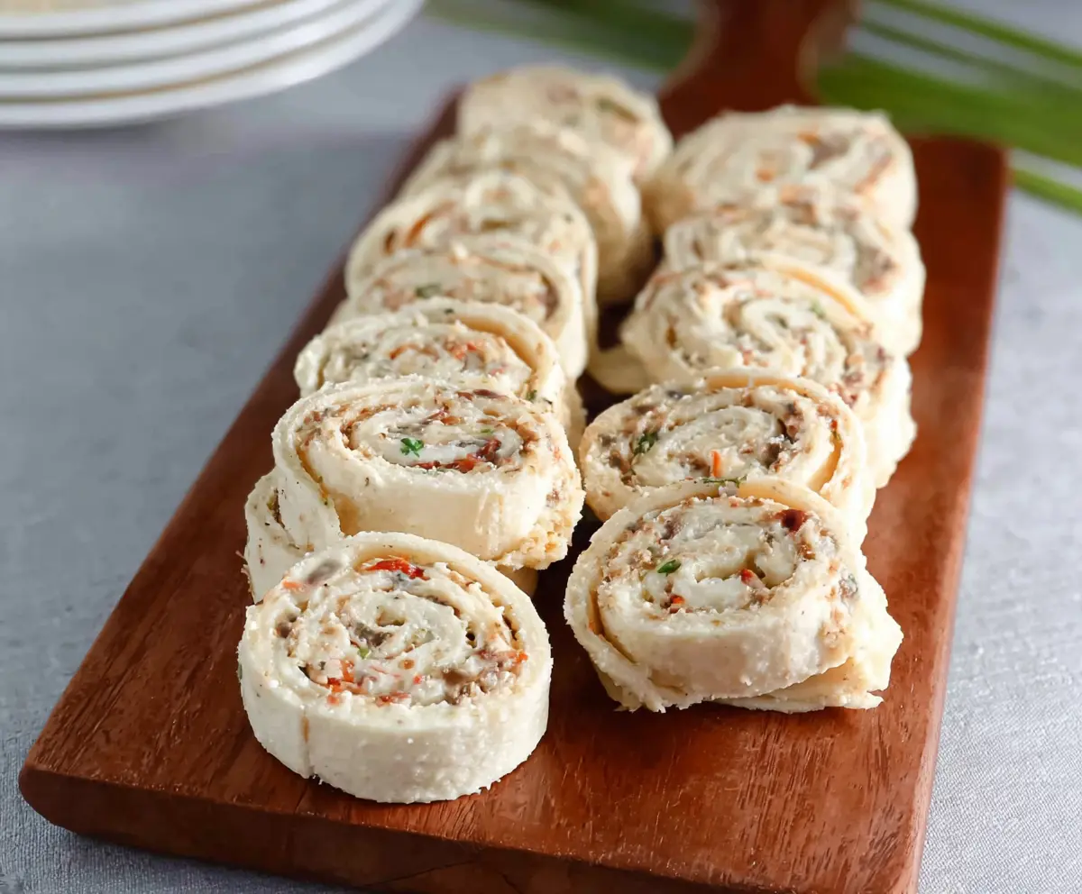 Delicious cream cheese pinwheels with fragrant herbs and crispy pastry slices.