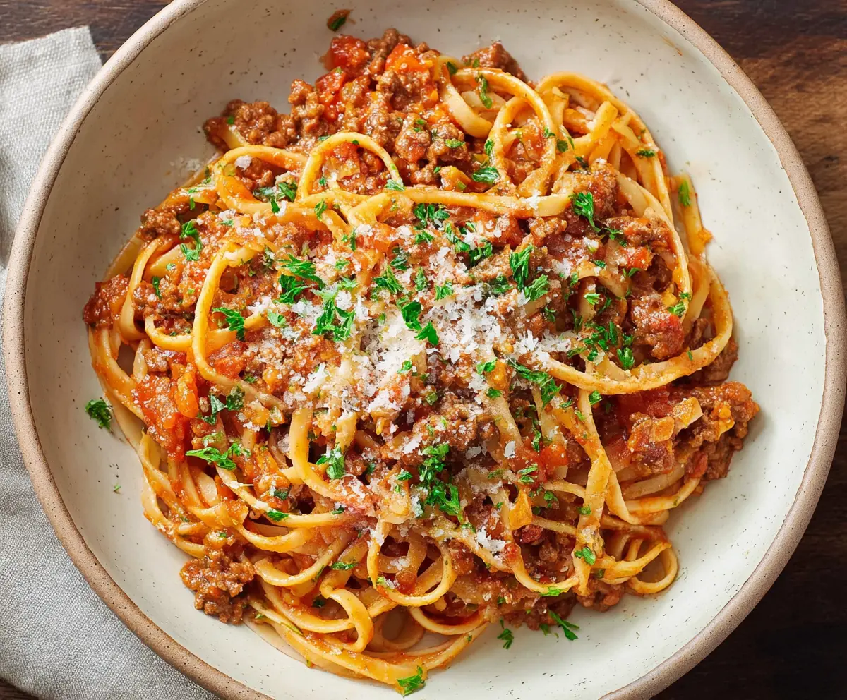 Delicious Bolognese pasta served with rich tomato sauce and fresh herbs