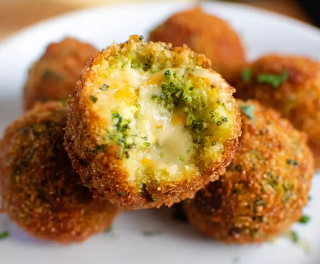 Delicious homemade broccoli cheddar poppers on a plate, perfect for appetizer snacks.