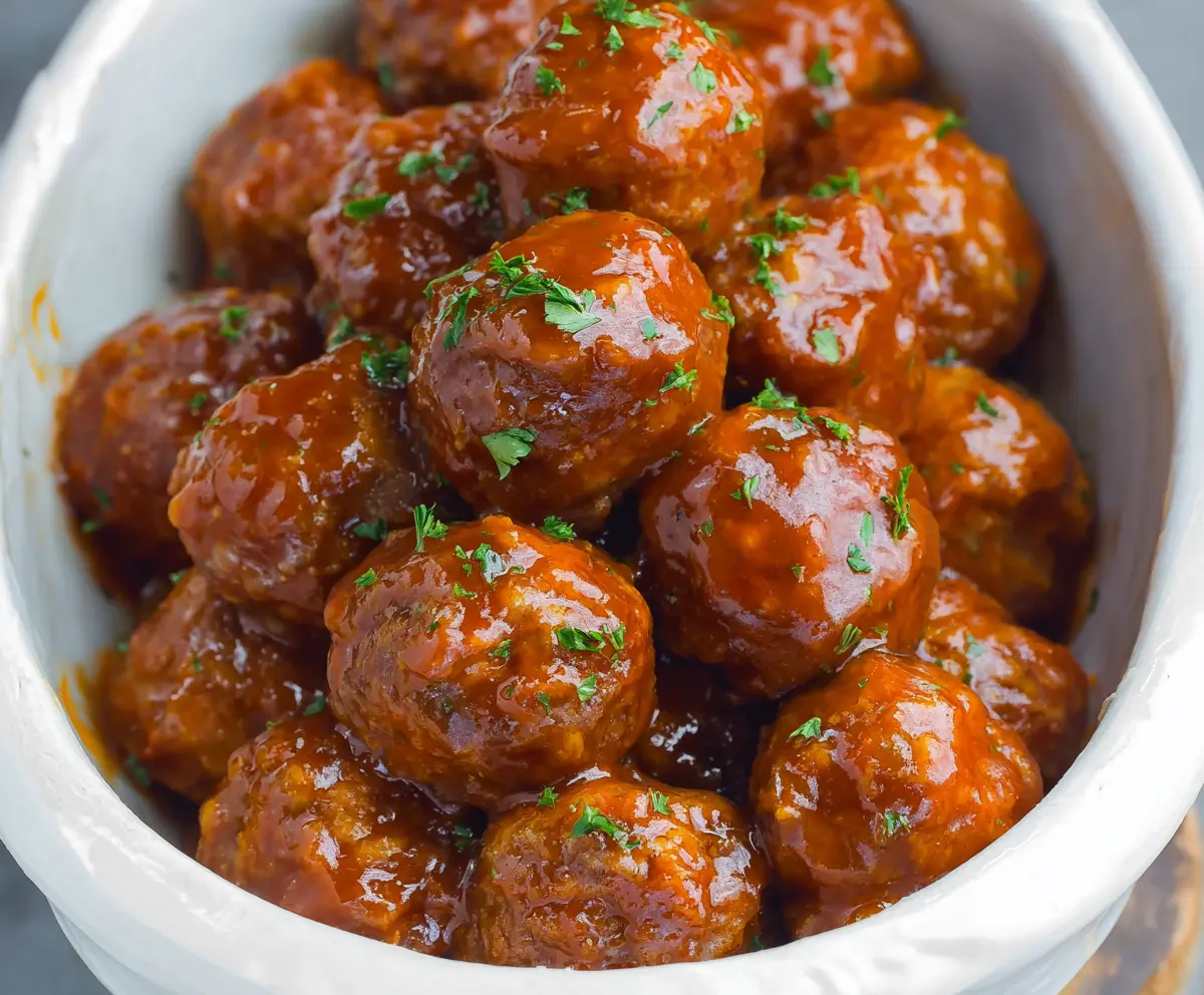 Delicious slow cooker honey buffalo meatballs served with a side of fresh vegetables