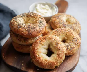 Healthy almond flour Greek yogurt bagels on a white plate, perfect for low-carb breakfast.