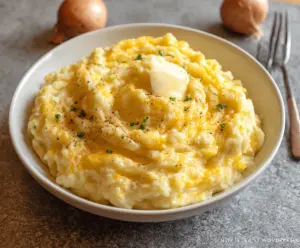 Creamy cheddar garlic mashed potatoes served as a delicious side dish.