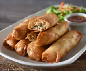 Crispy Chicken Lumpia with dipping sauce on a plate, Filipino appetizer