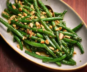 Fresh green beans tossed with crunchy pine nuts for a healthy side dish.